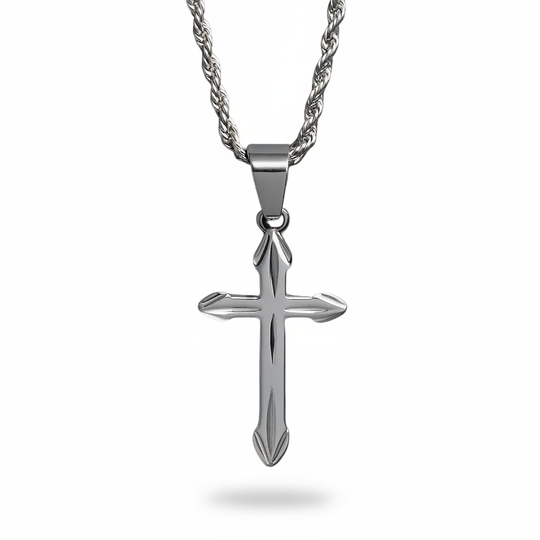 Silver decorative cross pendant necklace on white background