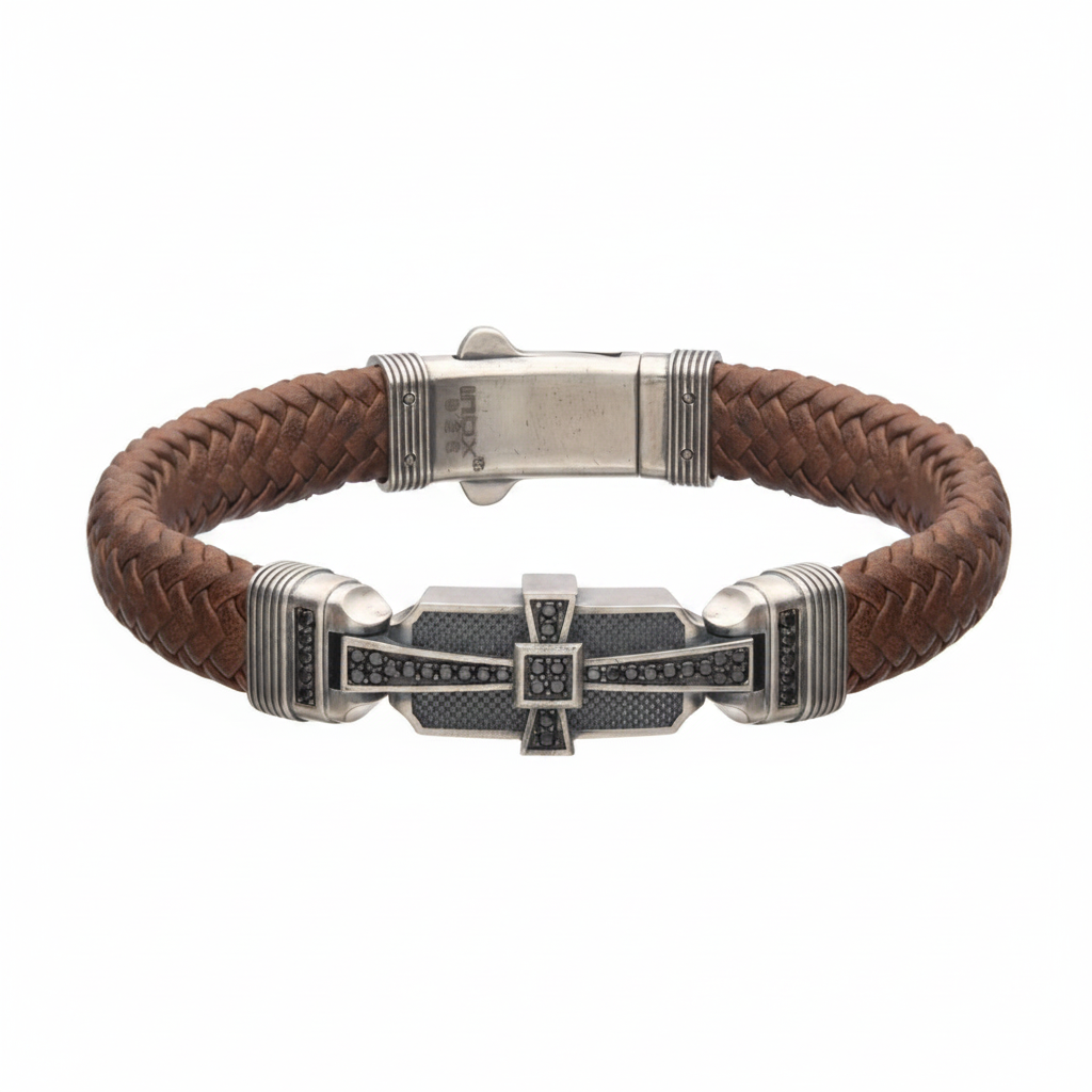 Brown braided leather bracelet with sterling silver cross on very light gray background