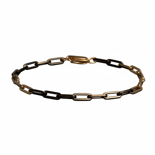 Two-tone paperclip chain bracelet on white background