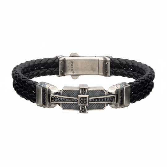 Double braid black leather bracelet with sterling silver cross on light gray background